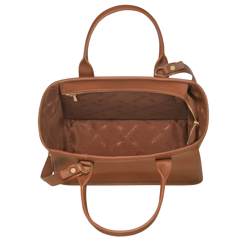 Longchamp on X: Rewriting the classics. The iconic leather of the